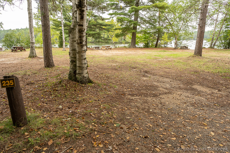 Campsite Photo of Site 263 at Fish Creek Pond Campground, New York - Looking at Site from Road Sign Visible