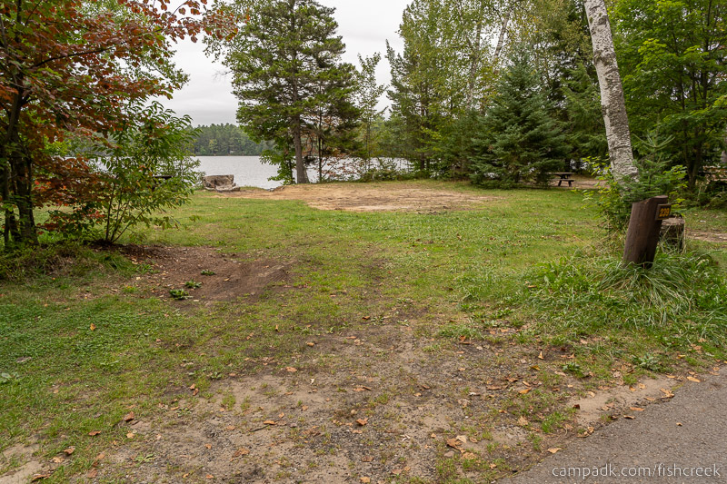 Campsite Photo of Site 267 at Fish Creek Pond Campground, New York - Looking at Site from Road Sign Visible