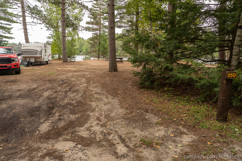 Campsite Photo of Site 278 at Fish Creek Pond Campground, New York - Looking at Site from Road Sign Visible