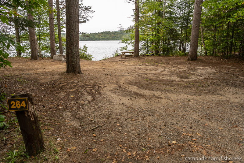 Campsite Photo of Site 292 at Fish Creek Pond Campground, New York - Looking at Site from Road Sign Visible