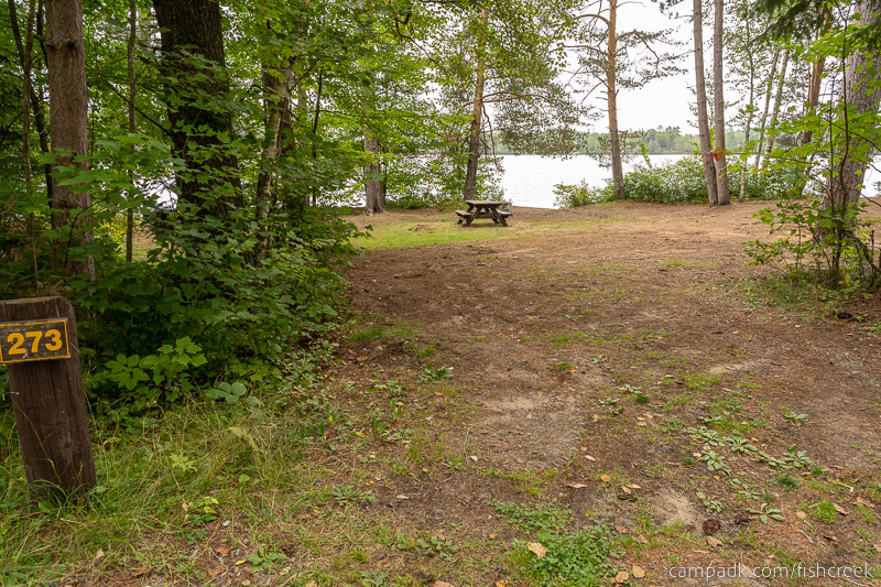 Campsite Photo of Site 301 at Fish Creek Pond Campground, New York - Looking at Site from Road Sign Visible