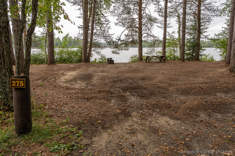 Campsite Photo of Site 303 at Fish Creek Pond Campground, New York - Looking at Site from Road Sign Visible