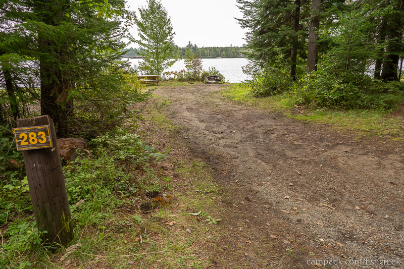 Campsite Photo of Site 311 at Fish Creek Pond Campground, New York - Looking at Site from Road Sign Visible