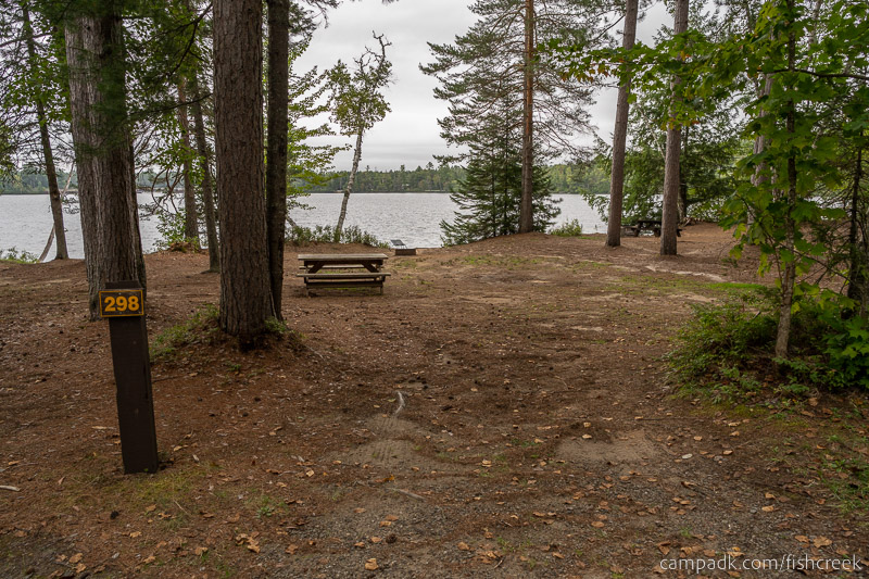 Campsite Photo of Site 324 at Fish Creek Pond Campground, New York - Looking at Site from Road Sign Visible