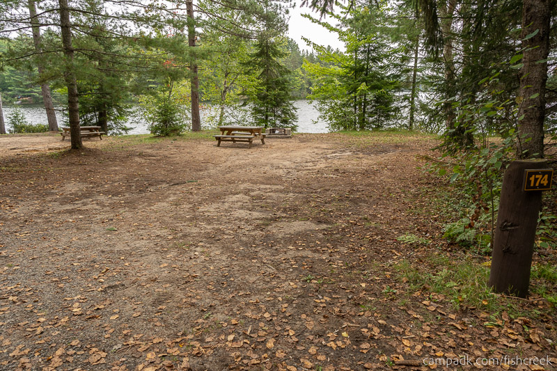 Campsite Photo of Site 203 at Fish Creek Pond Campground, New York - Looking at Site from Road Sign Visible