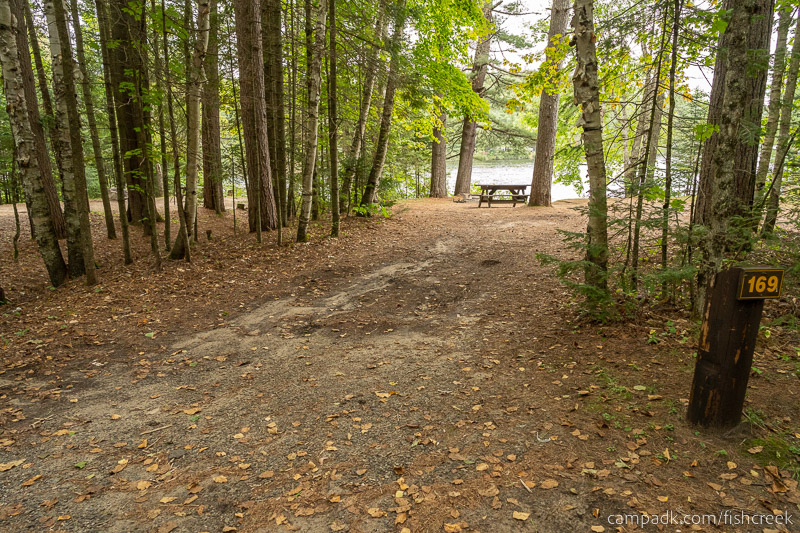 Campsite Photo of Site 198 at Fish Creek Pond Campground, New York - Looking at Site from Road Sign Visible