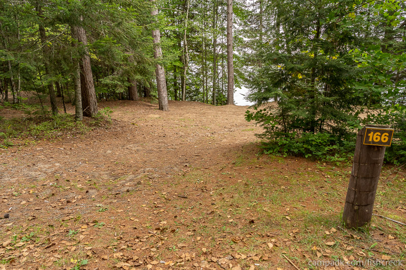 Campsite Photo of Site 196 at Fish Creek Pond Campground, New York - Looking at Site from Road Sign Visible
