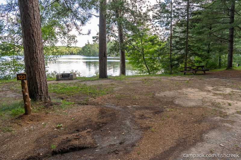 Campsite Photo of Site 155 at Fish Creek Pond Campground, New York - Looking at Site from Road Sign Visible