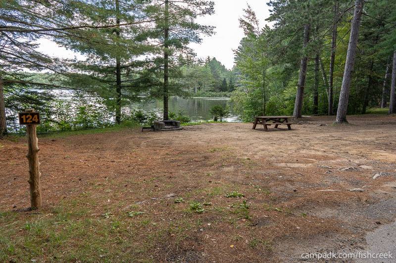 Campsite Photo of Site 156 at Fish Creek Pond Campground, New York - Looking at Site from Road Sign Visible