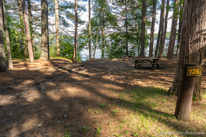 Campsite Photo of Site 158 at Fish Creek Pond Campground, New York - Looking at Site from Road Sign Visible