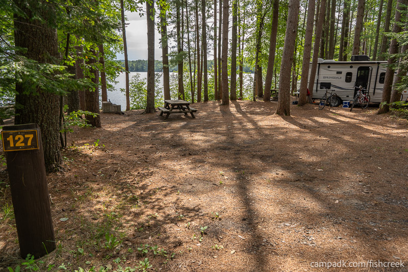 Campsite Photo of Site 159 at Fish Creek Pond Campground, New York - Looking at Site from Road Sign Visible