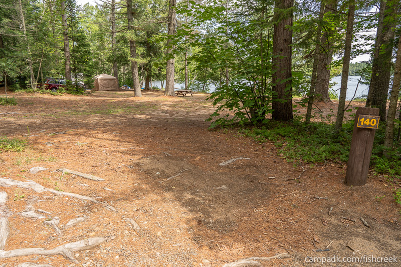 Campsite Photo of Site 170 at Fish Creek Pond Campground, New York - Looking at Site from Road Sign Visible