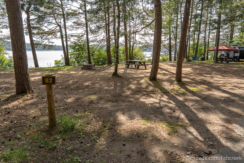 Campsite Photo of Site 114 at Fish Creek Pond Campground, New York - Looking at Site from Road Sign Visible