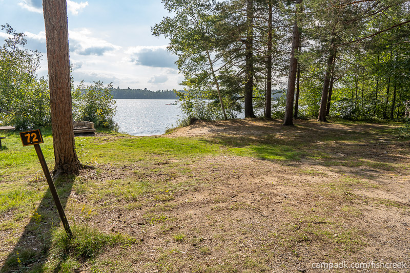 Campsite Photo of Site 97 at Fish Creek Pond Campground, New York - Looking at Site from Road Sign Visible