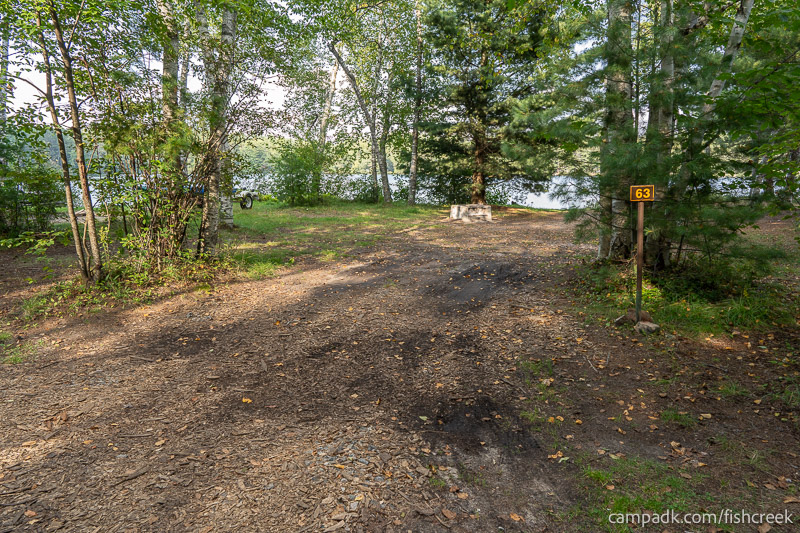 Campsite Photo of Site 81 at Fish Creek Pond Campground, New York - Looking at Site from Road Sign Visible