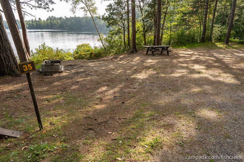 Campsite Photo of Site 36 at Fish Creek Pond Campground, New York - Looking at Site from Road Sign Visible