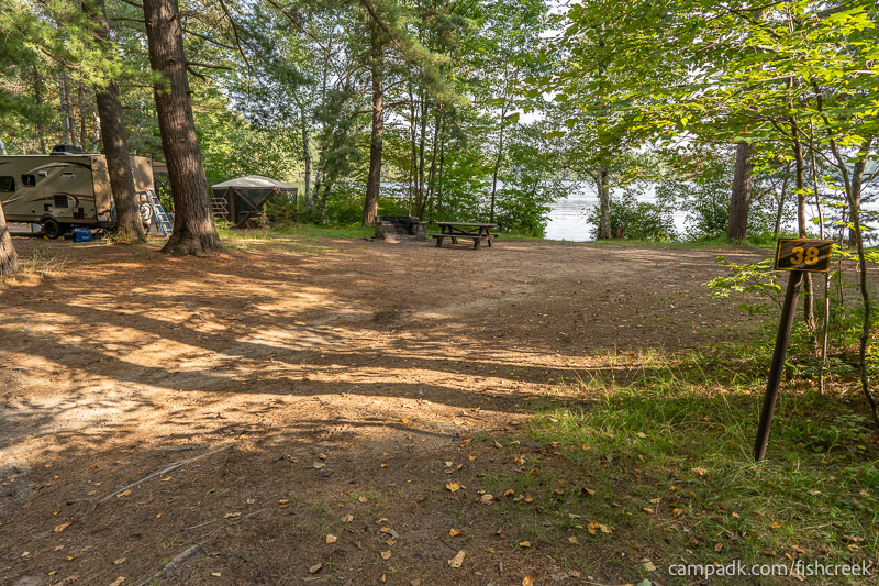Campsite Photo of Site 48 at Fish Creek Pond Campground, New York - Looking at Site from Road Sign Visible