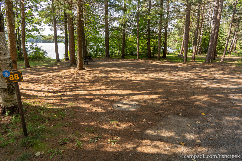 Campsite Photo of Site 120 at Fish Creek Pond Campground, New York - Looking at Site from Road Sign Visible