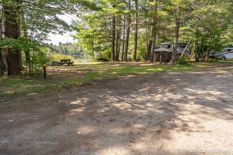 Campsite Photo of Site 33 at Fish Creek Pond Campground, New York - Looking at Site from Road Sign Visible