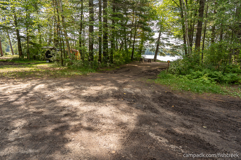 Campsite Photo of Site 30 at Fish Creek Pond Campground, New York - Looking at Site from Road Sign Visible