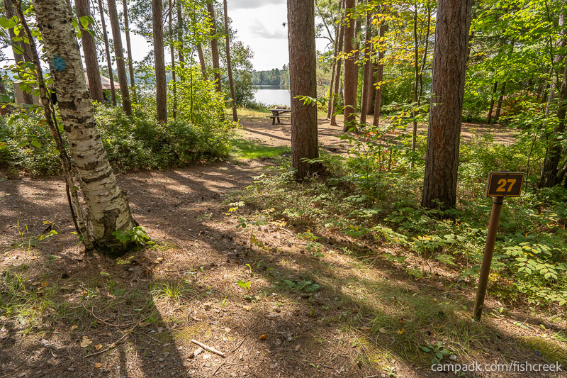 Campsite Photo of Site 29 at Fish Creek Pond Campground, New York - Looking at Site from Road Sign Visible