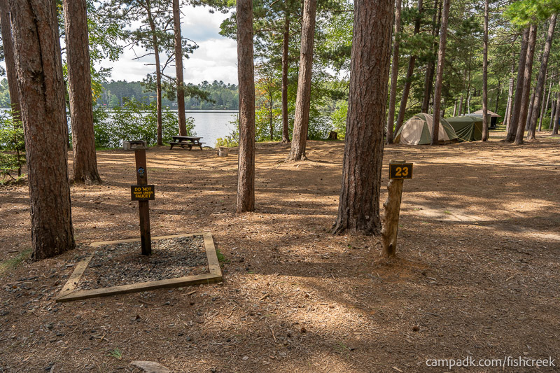 Campsite Photo of Site 20 at Fish Creek Pond Campground, New York - Looking at Site from Road Sign Visible
