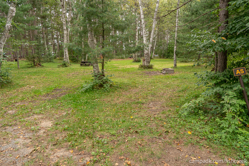 Campsite Photo of Site 72 at Fish Creek Pond Campground, New York - Looking at Site from Road Sign Visible