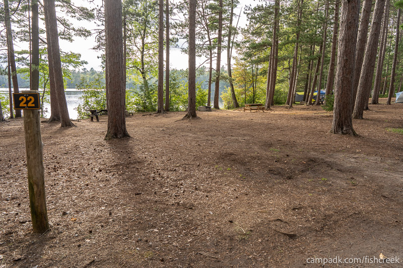 Campsite Photo of Site 19 at Fish Creek Pond Campground, New York - Looking at Site from Road Sign Visible