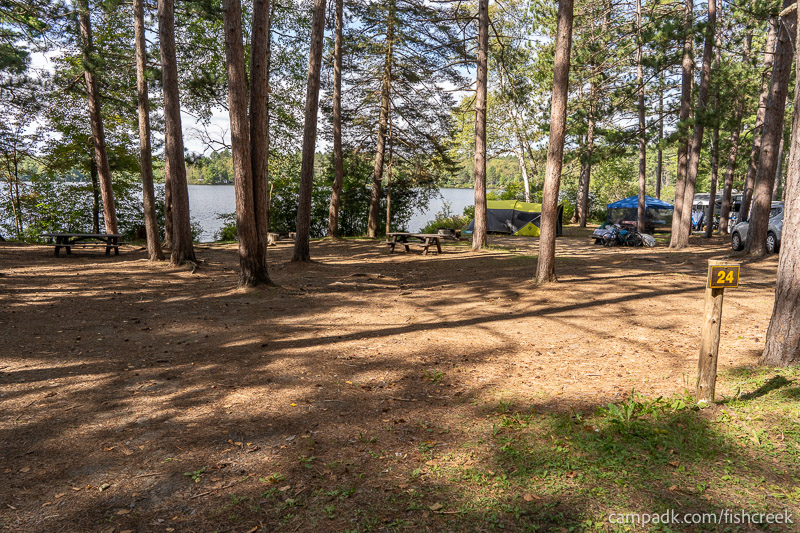 Campsite Photo of Site 26 at Fish Creek Pond Campground, New York - Looking at Site from Road Sign Visible