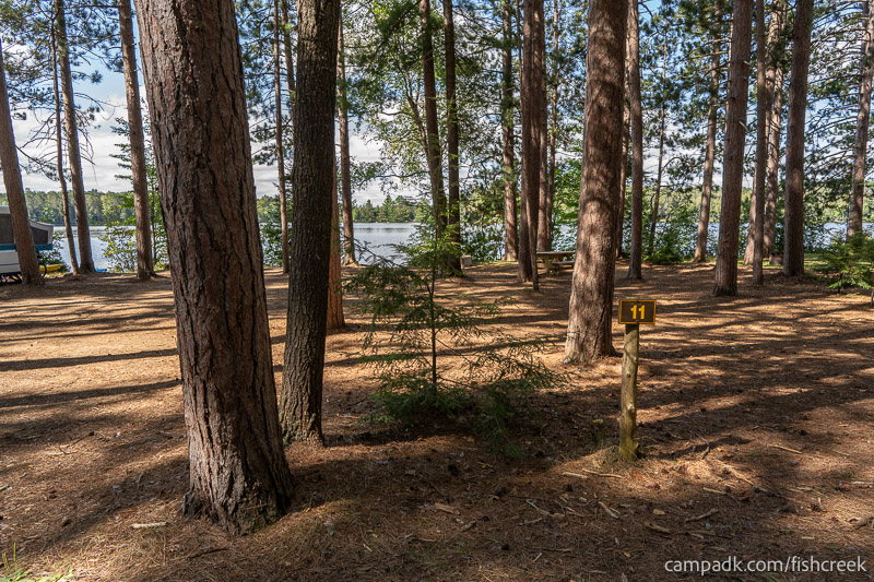 Campsite Photo of Site 8 at Fish Creek Pond Campground, New York - Looking at Site from Road Sign Visible