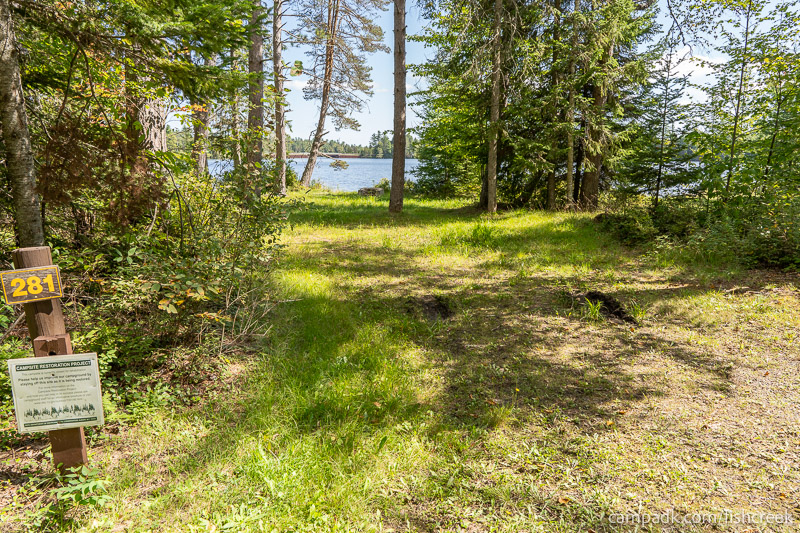 Campsite Photo of Site 309 at Fish Creek Pond Campground, New York - Looking at Site from Road Sign Visible