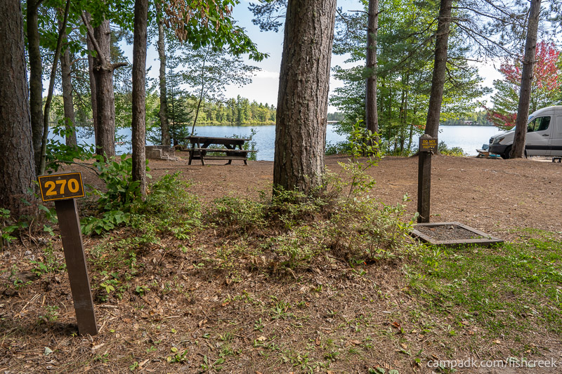 Campsite Photo of Site 298 at Fish Creek Pond Campground, New York - Looking at Site from Road Sign Visible