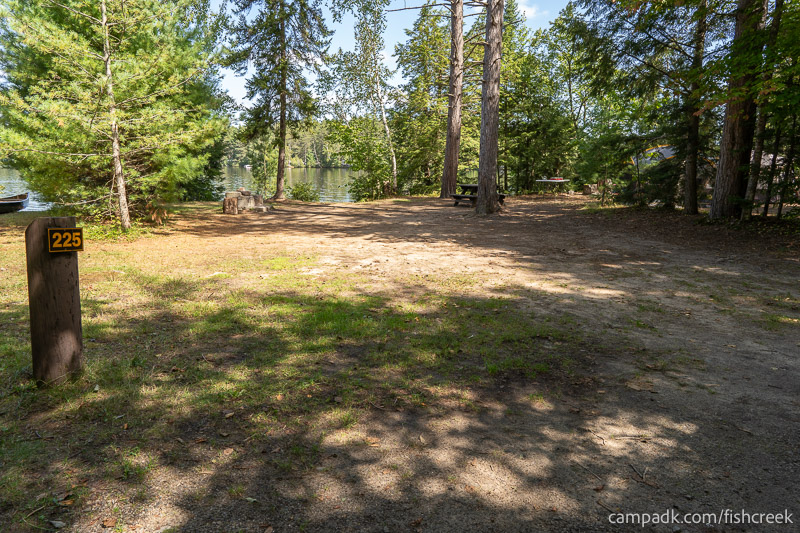 Campsite Photo of Site 253 at Fish Creek Pond Campground, New York - Looking at Site from Road Sign Visible