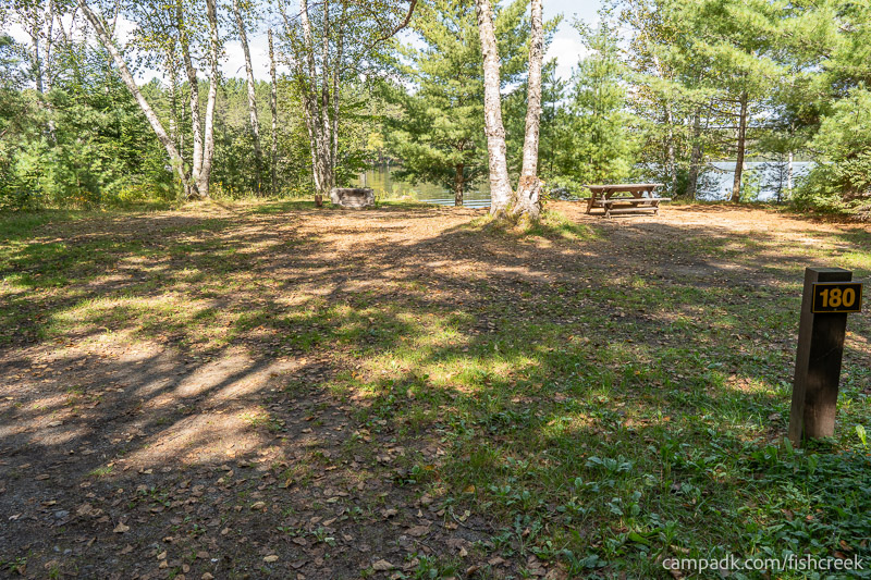 Campsite Photo of Site 209 at Fish Creek Pond Campground, New York - Looking at Site from Road Sign Visible