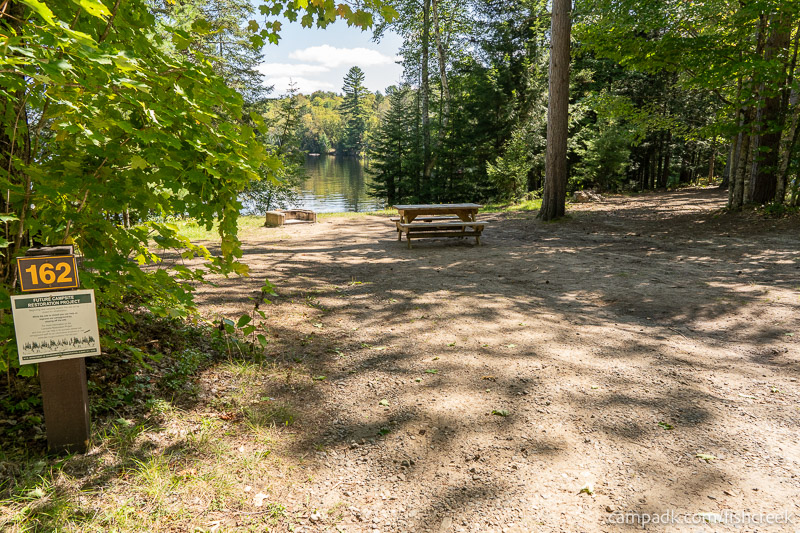 Campsite Photo of Site 192 at Fish Creek Pond Campground, New York - Looking at Site from Road Sign Visible