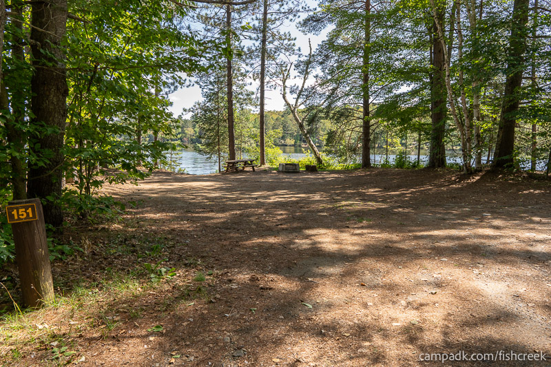 Campsite Photo of Site 181 at Fish Creek Pond Campground, New York - Looking at Site from Road Sign Visible