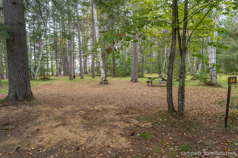 Campsite Photo of Site 73 at Fish Creek Pond Campground, New York - Looking at Site from Road Sign Visible