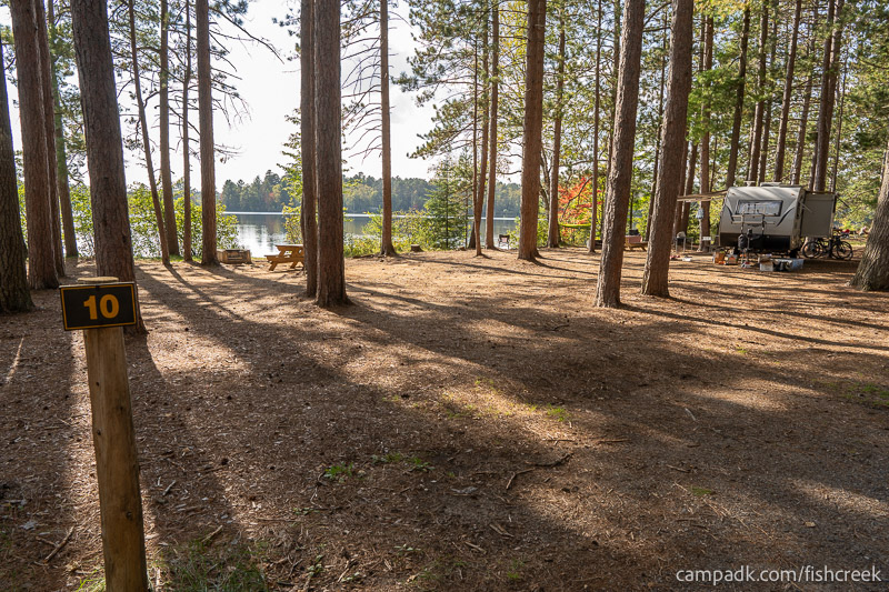 Campsite Photo of Site 6 at Fish Creek Pond Campground, New York - Looking at Site from Road Sign Visible