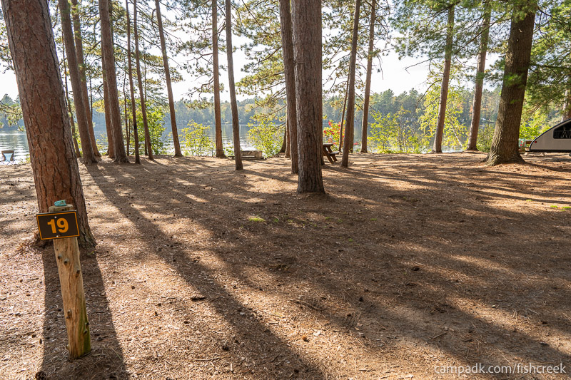 Campsite Photo of Site 16 at Fish Creek Pond Campground, New York - Looking at Site from Road Sign Visible