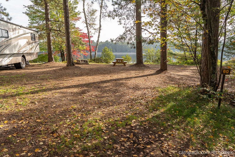 Campsite Photo of Site 76 at Fish Creek Pond Campground, New York - Looking at Site from Road Sign Visible