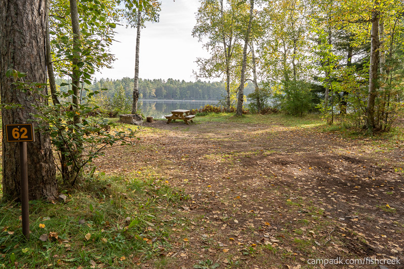 Campsite Photo of Site 80 at Fish Creek Pond Campground, New York - Looking at Site from Road Sign Visible