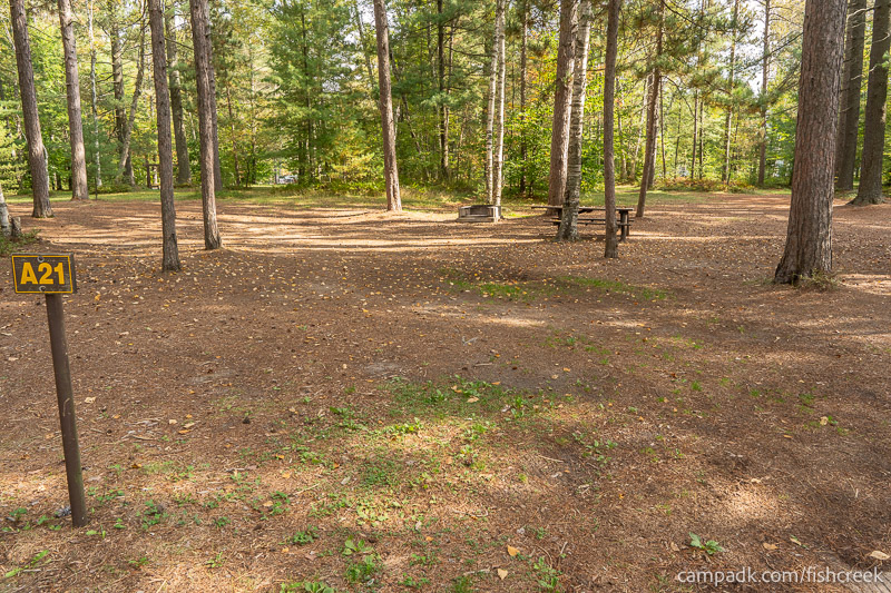 Campsite Photo of Site 107 at Fish Creek Pond Campground, New York - Looking at Site from Road Sign Visible