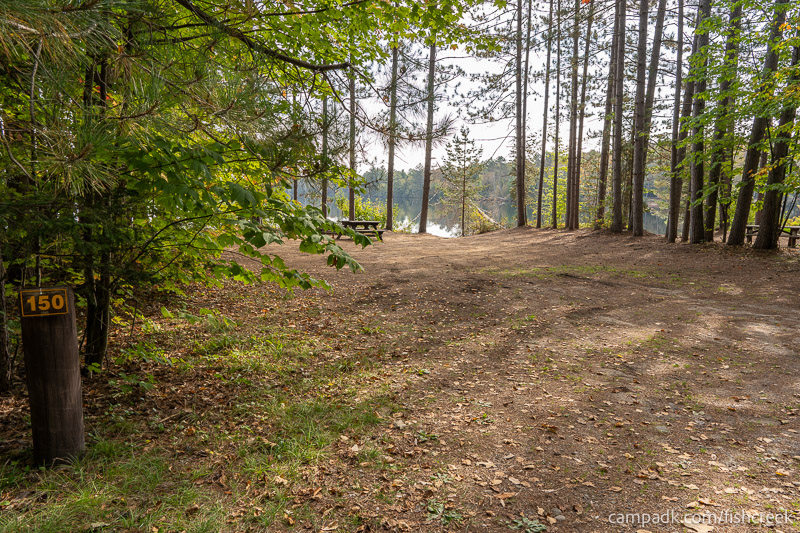 Campsite Photo of Site 180 at Fish Creek Pond Campground, New York - Looking at Site from Road Sign Visible