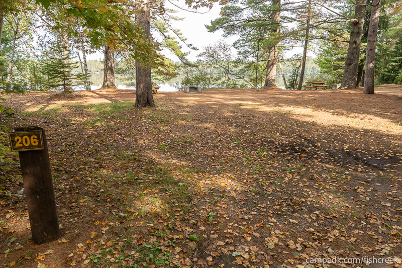 Campsite Photo of Site 234 at Fish Creek Pond Campground, New York - Looking at Site from Road Sign Visible