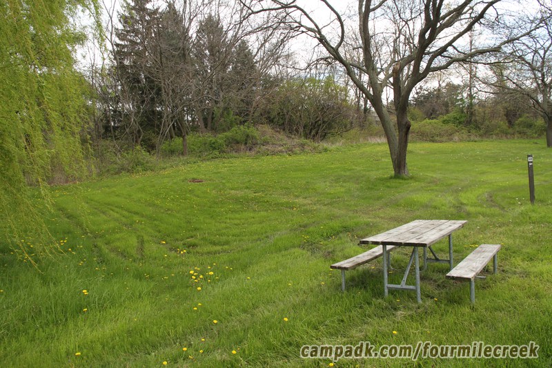 Campsite Photo of Site 304 at Four Mile Creek State Park, New York - Looking at Site from Road Sign Visible