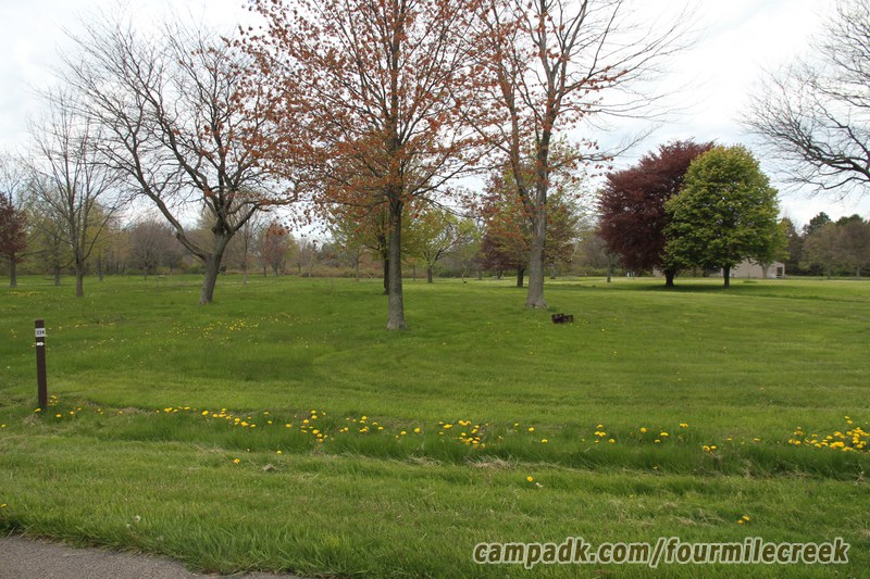 Campsite Photo of Site 334 at Four Mile Creek State Park, New York - Looking at Site from Road Sign Visible