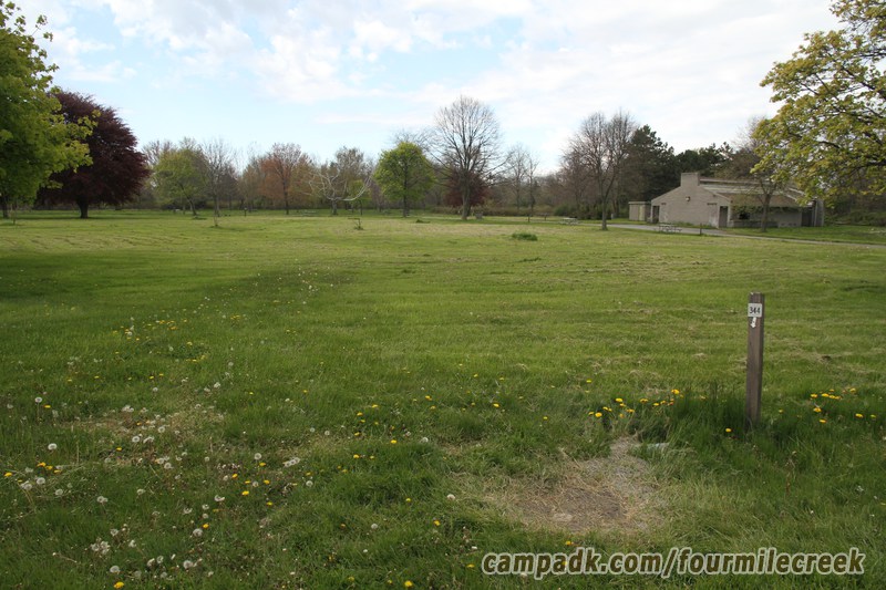 Campsite Photo of Site 344 at Four Mile Creek State Park, New York - Looking at Site from Road Sign Visible
