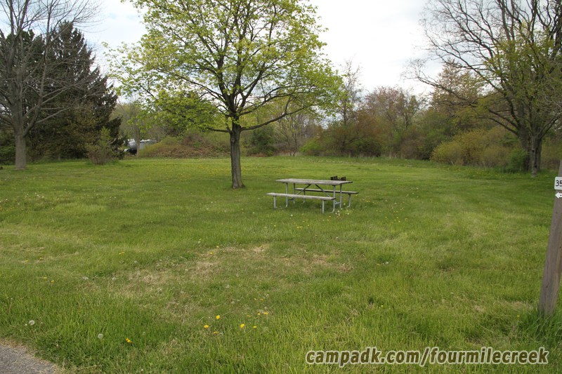 Campsite Photo of Site 353 at Four Mile Creek State Park, New York - Looking at Site from Road Sign Visible