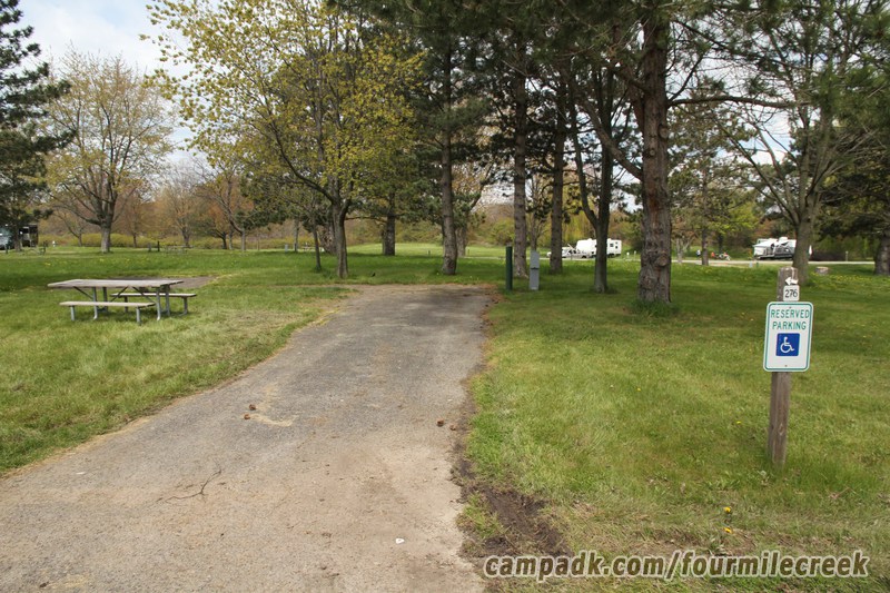 Campsite Photo of Site 276 at Four Mile Creek State Park, New York - Looking at Site from Road Sign Visible