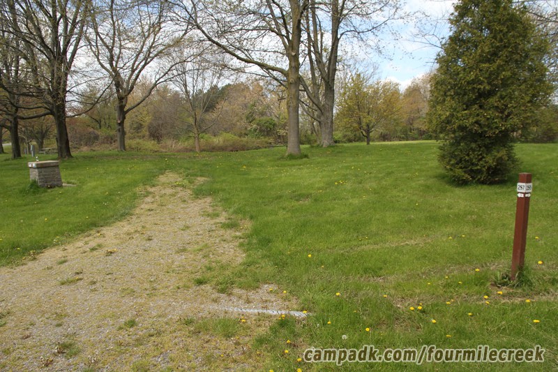 Campsite Photo of Site 257 at Four Mile Creek State Park, New York - Looking at Site from Road Sign Visible